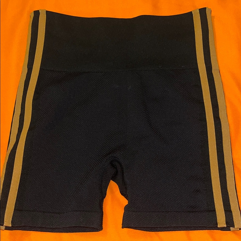 IVY PARK Black Shorts with Gold Stripes